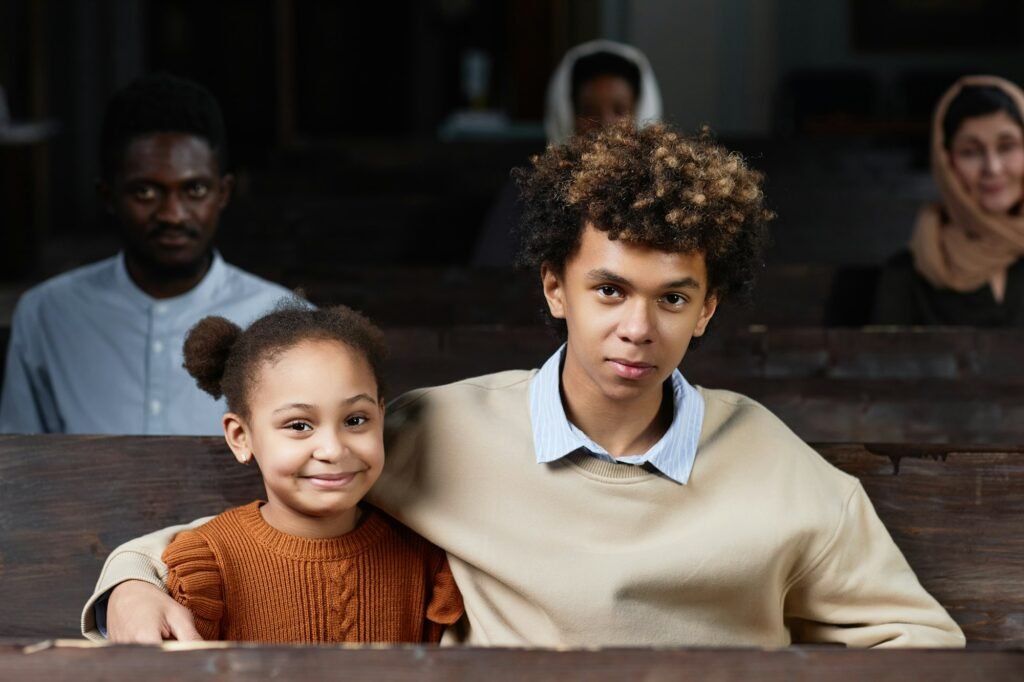 Children sitting on bench in church