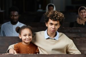 Children sitting on bench in church
